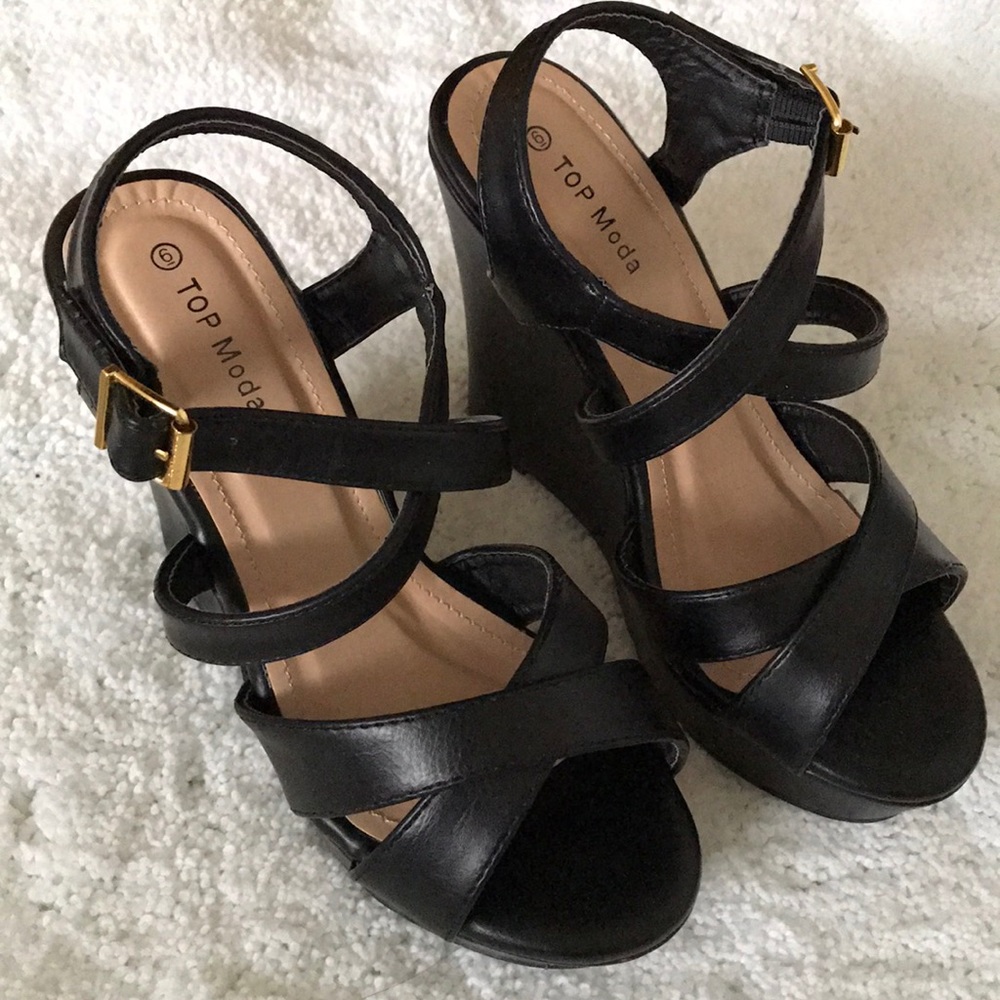 Never worn. Black strap wedges